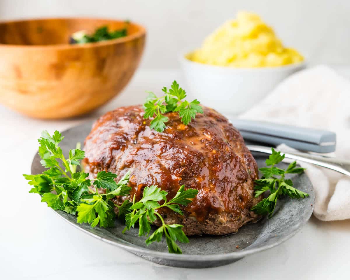 Serving the old fashioned meatloaf recipe with mashed potatoes and salad.