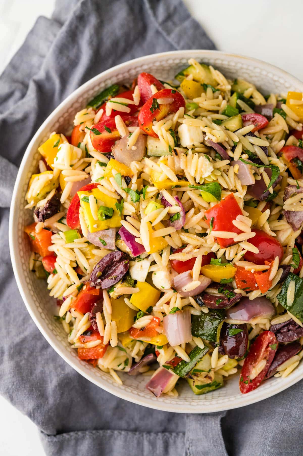 grilled vegetable orzo pasta salad in a bowl.