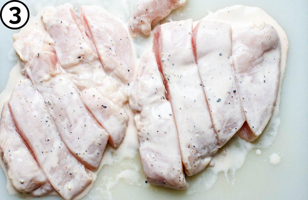 Slicing the chicken breasts.
