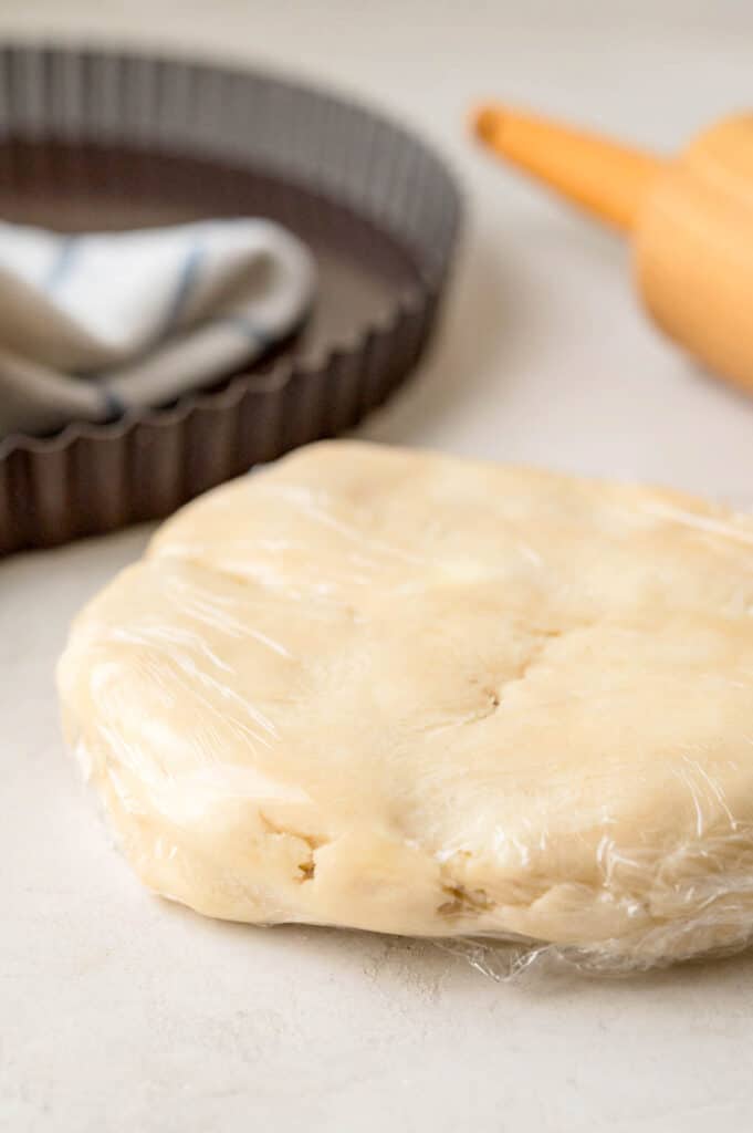 Cream cheese pastry wrapped in plastic wrap.
