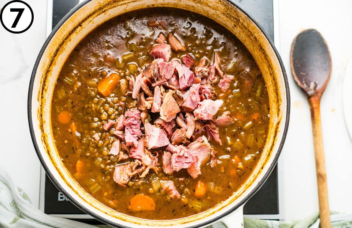 Add diced ham to the lentil soup.