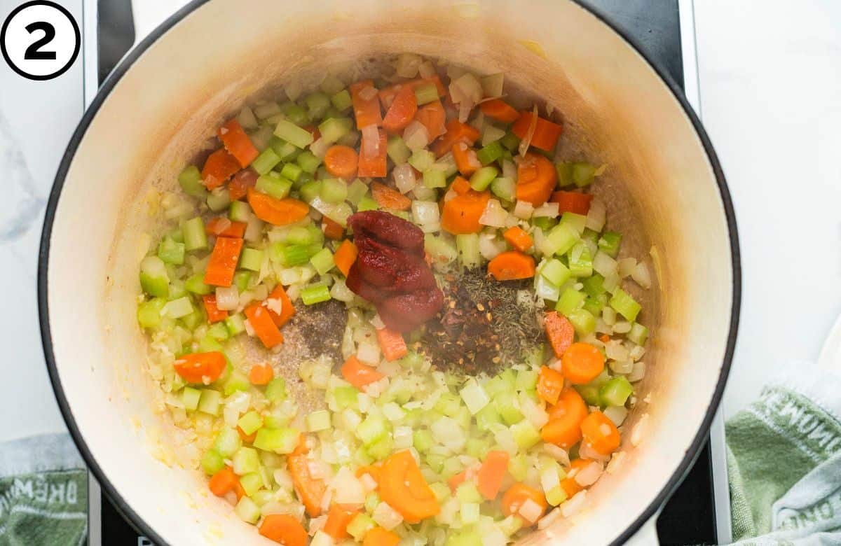 Add tomato paste, thyme and red pepper.
