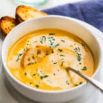 Parsnip and carrot soup with ginger and curry in a bowl.