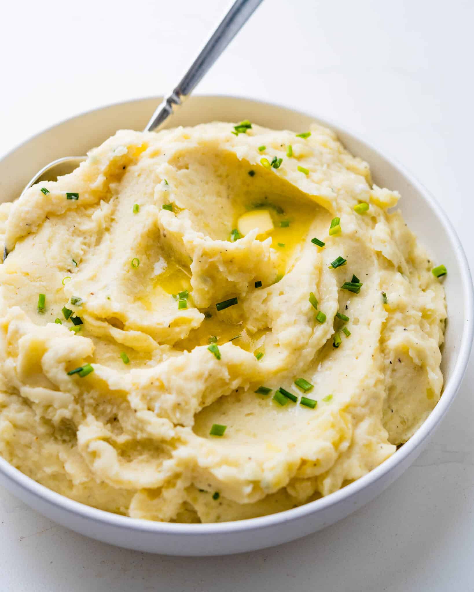 Spooning up the potatoes.
