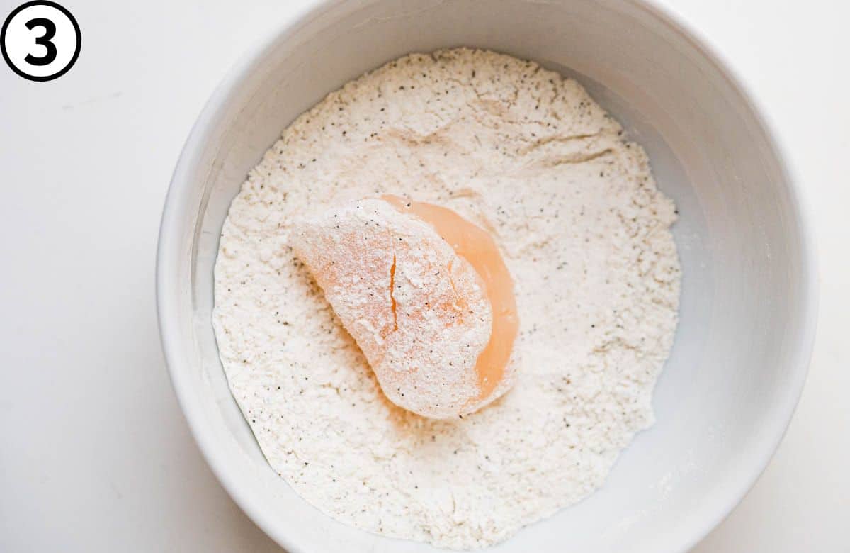 Lightly dip the top and bottom of the scallop in flour.