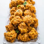 Sausage cheese balls on a platter.