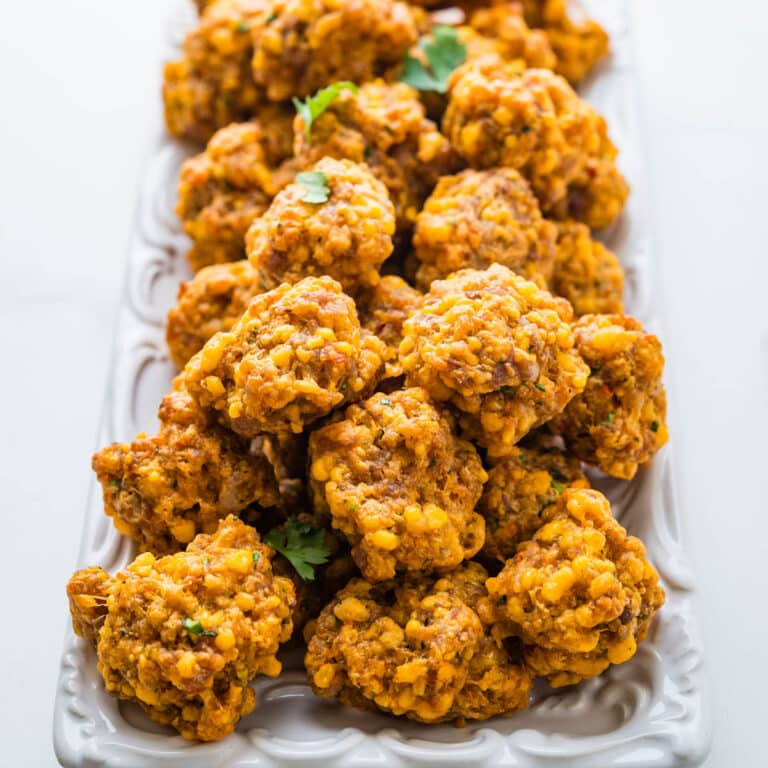 Sausage cheese balls on a platter.