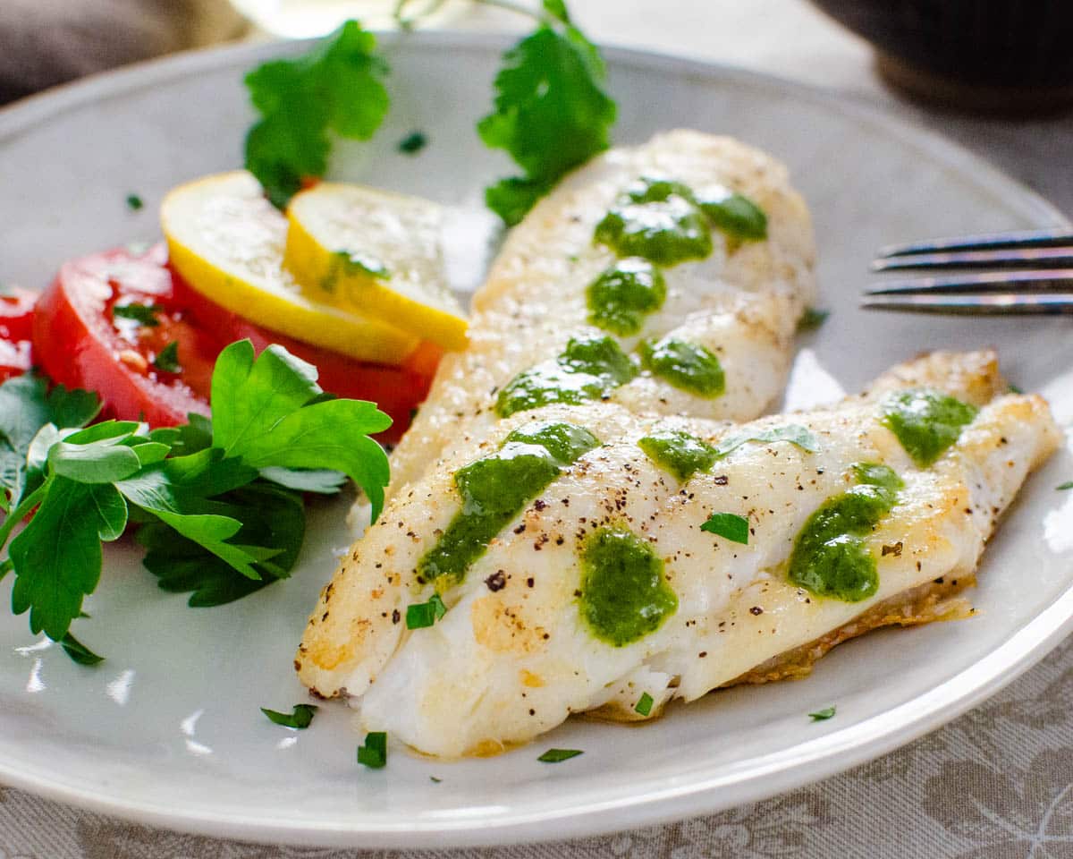hogfish snapper on a plate with Adriatic sauce.