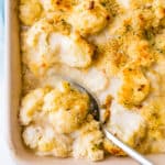 Spooning a serving of the gratin.