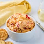 Pimento cheese in a white serving bowl.