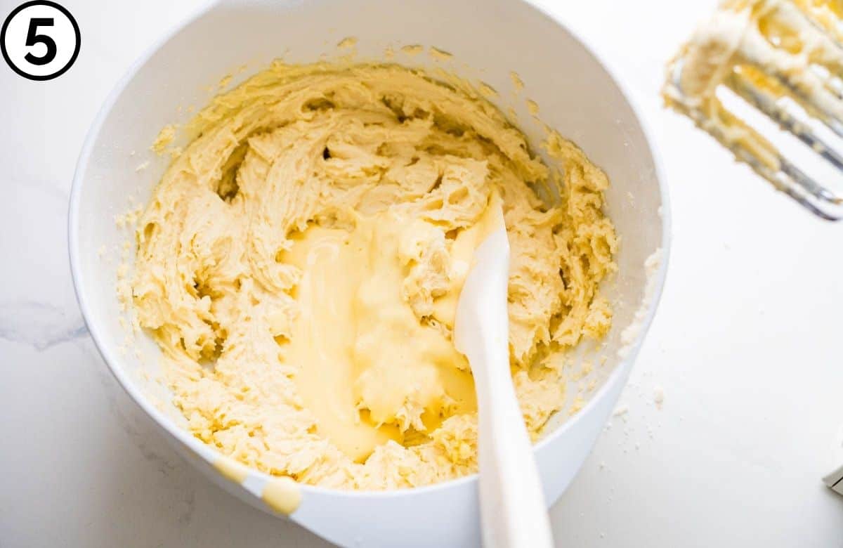 Add the egg yolk and sour cream mixture.