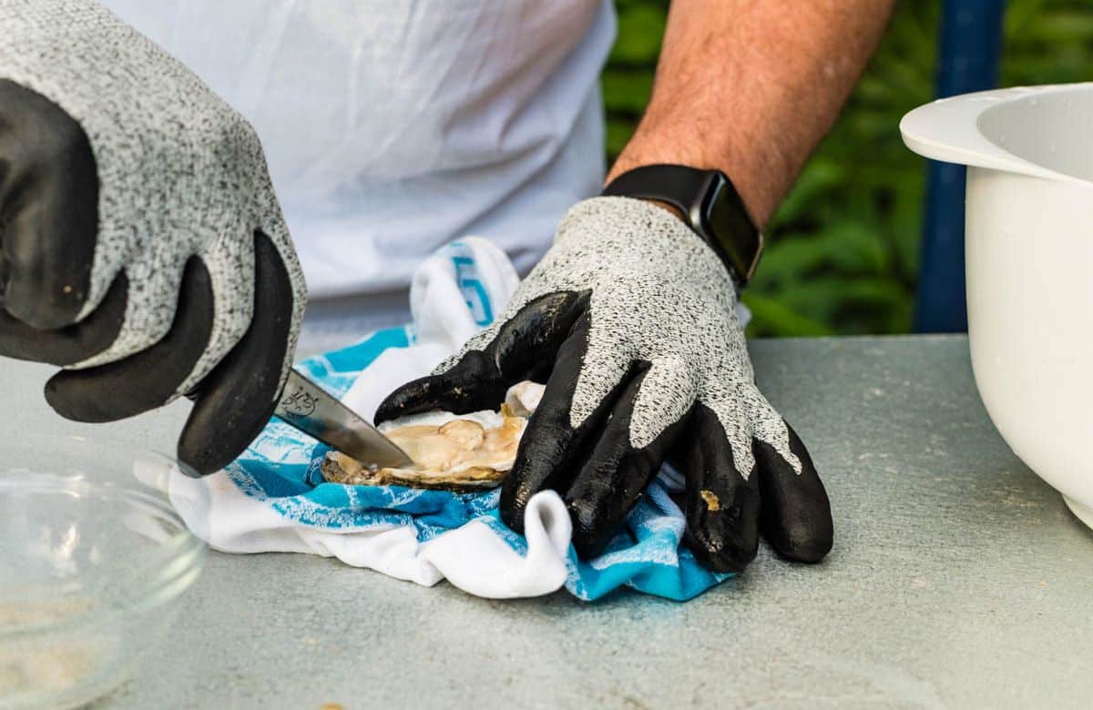 shucking an oyster.