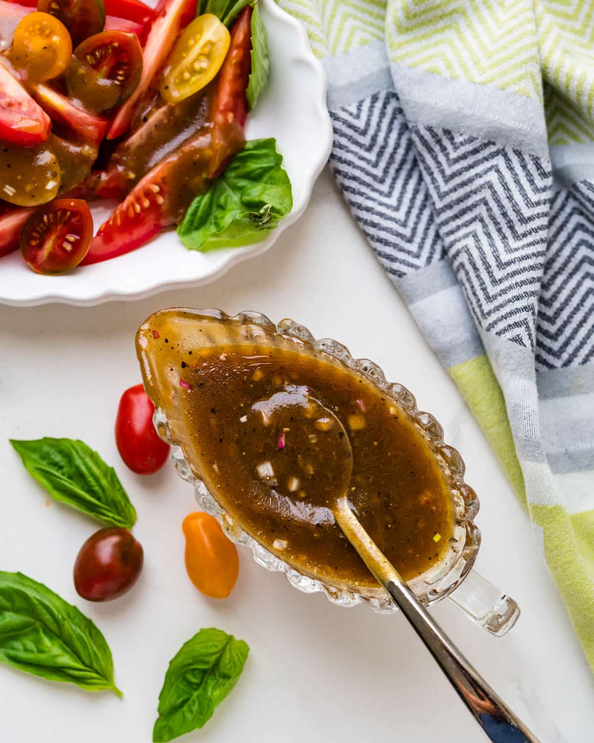 A dressing carafe with balsamic vinaigrette in it.