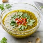 Mojo marinade in a glass bowl.