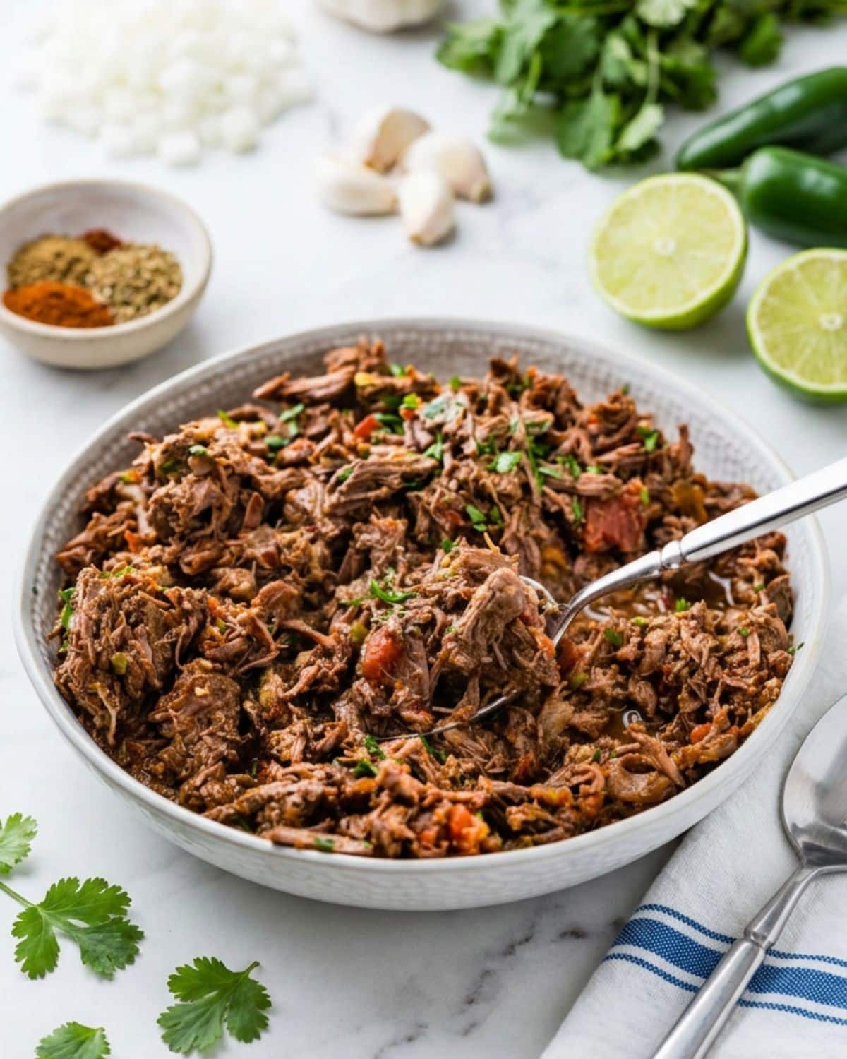 Spooning up some of the shredded beef.