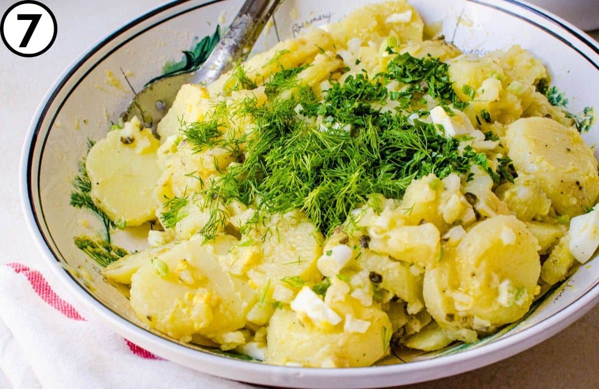 Add the dressing and chopped herbs.