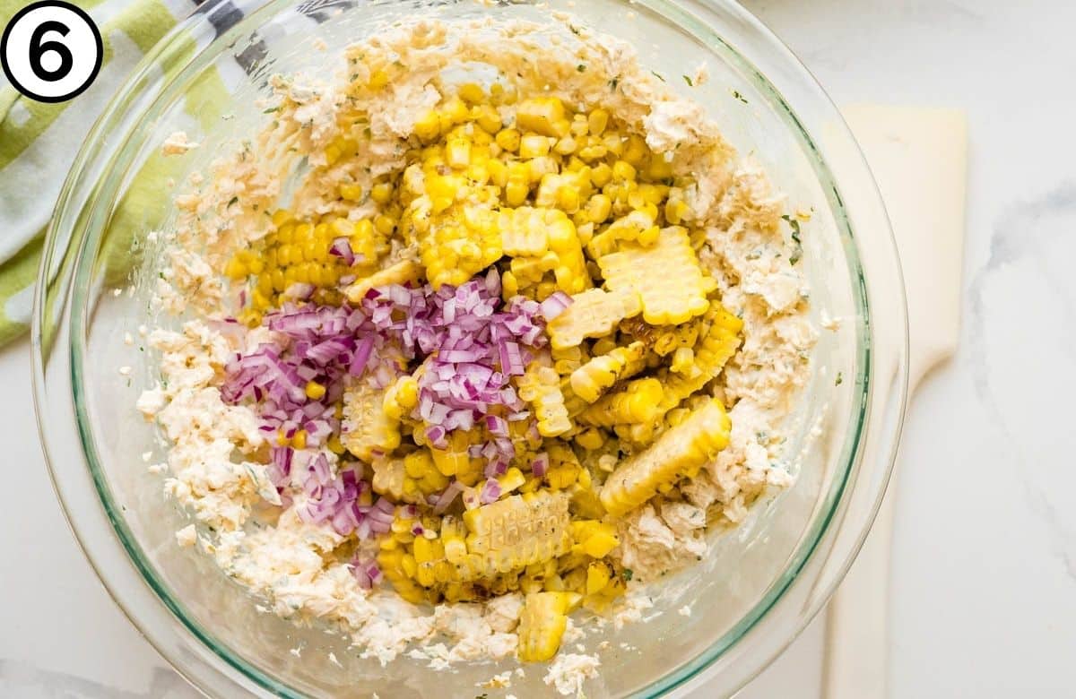 Add the charred corn and red onion to the bowl.