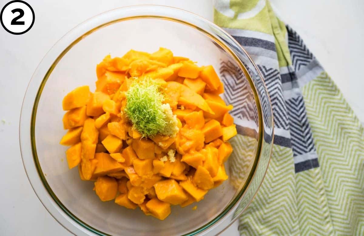 Add the ginger and lime to the mangoes.