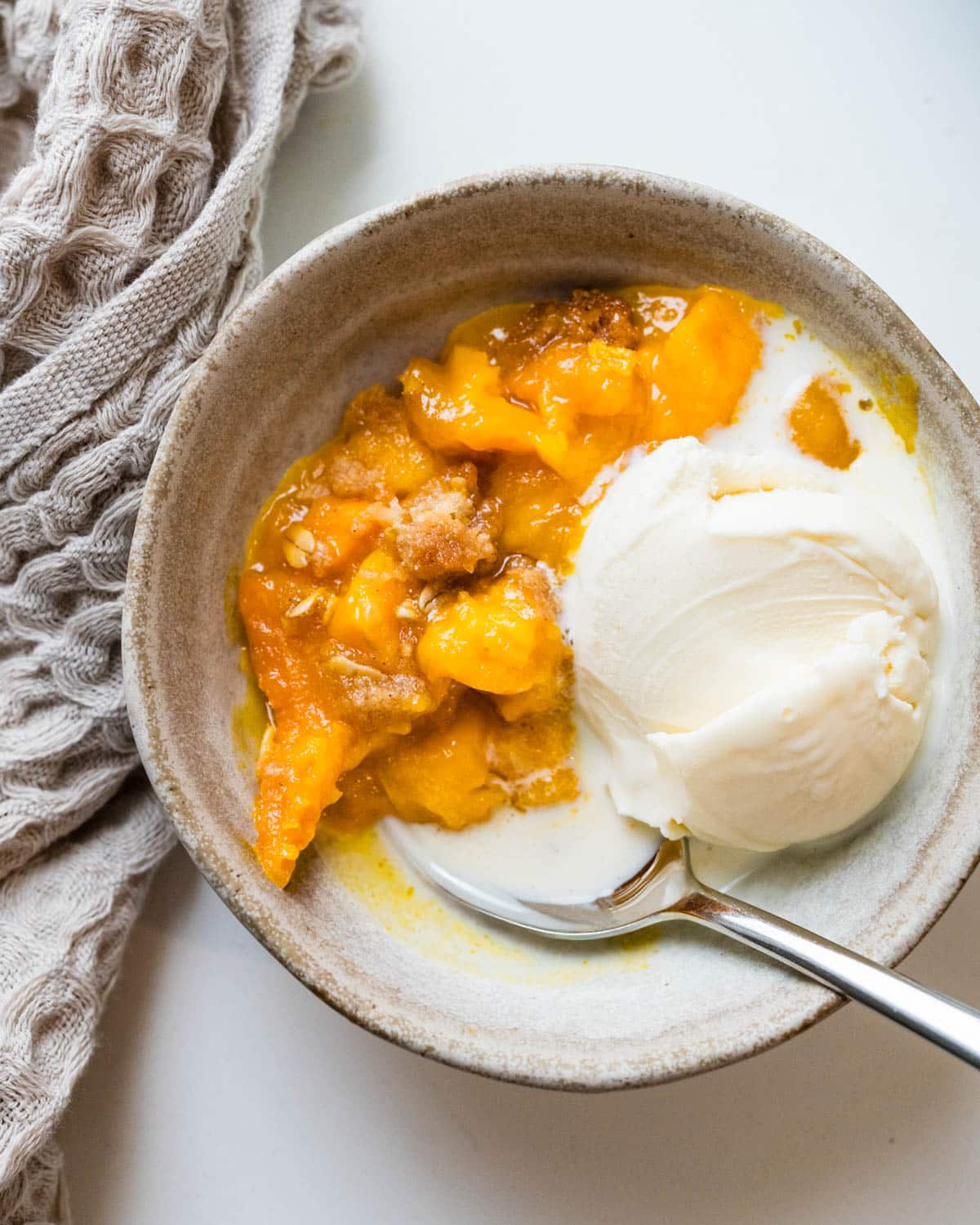mango crisp with a scoop of vanilla.