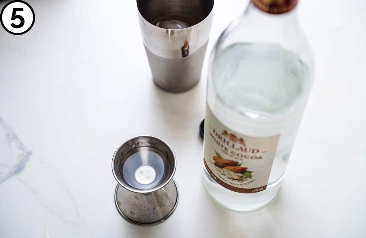 Adding creme de cacao.