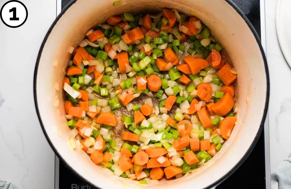 Sauteing the mirepoix in olive oil.