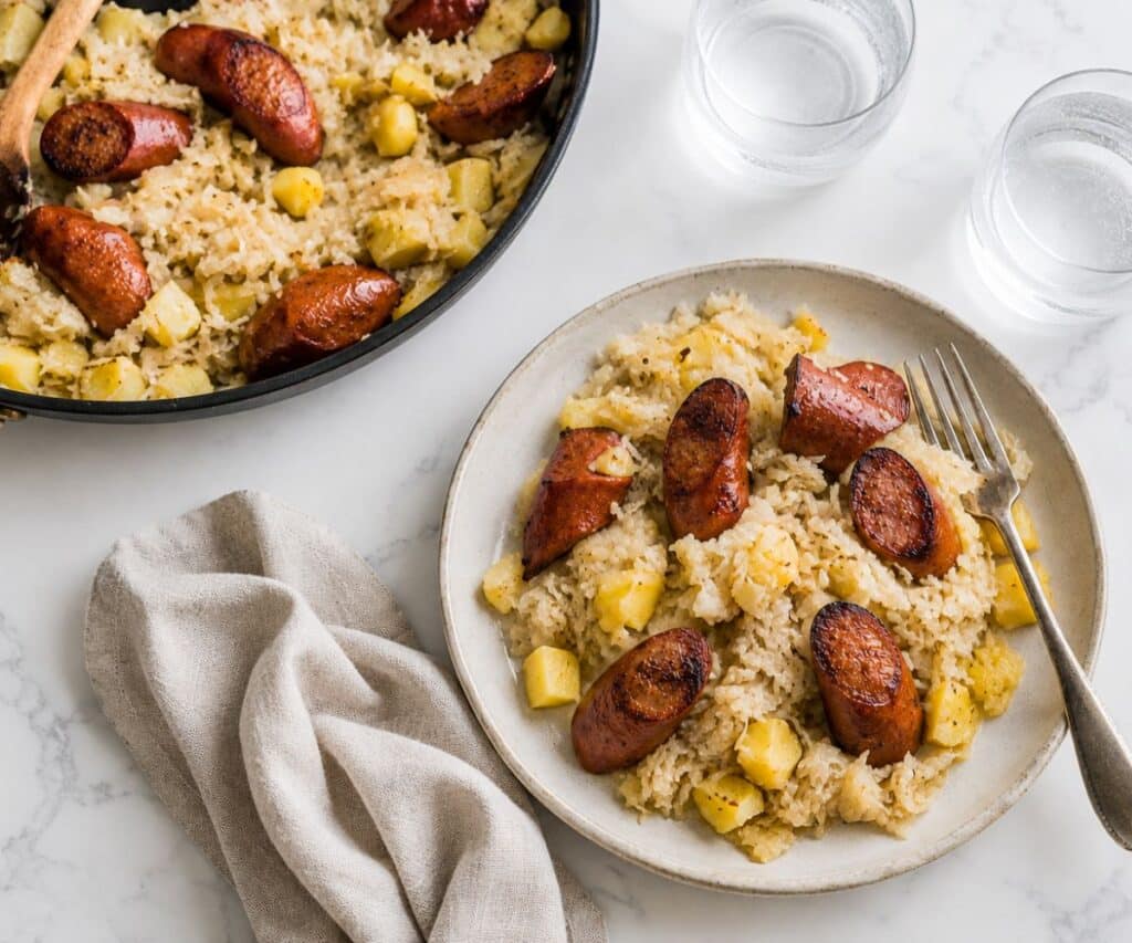 Serving the quick kielbasa and sauerkraut skillet on a stoneware plate.