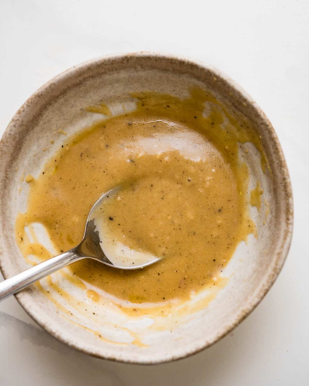A bowl of the red wine vinaigrette after whisking.