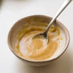 Creamy Red wine vinaigrette in a stoneware bowl.