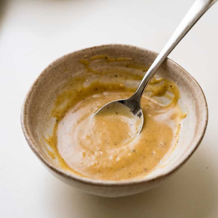 Creamy Red wine vinaigrette in a stoneware bowl.