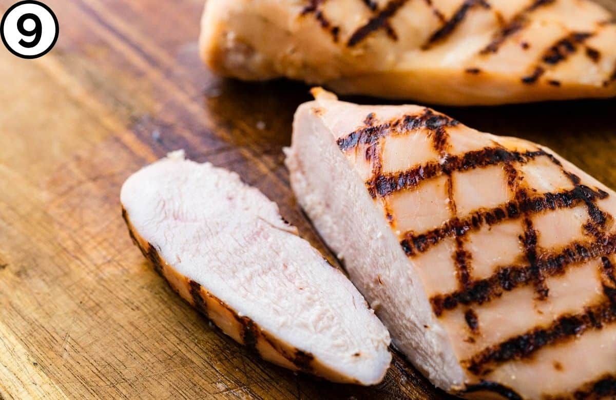 Slicing the chicken breasts to show moisture.