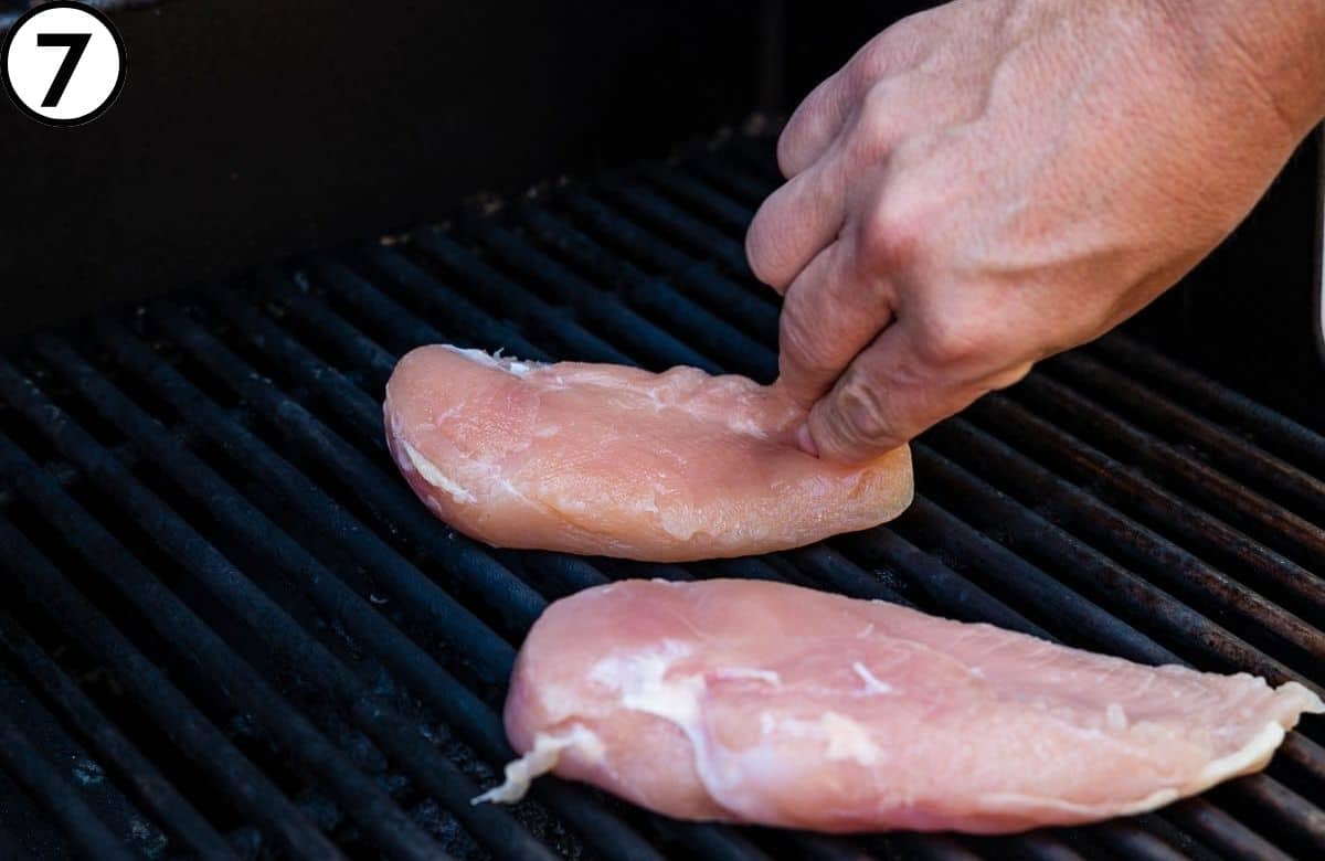 Cooking the brined chicken on a grill.