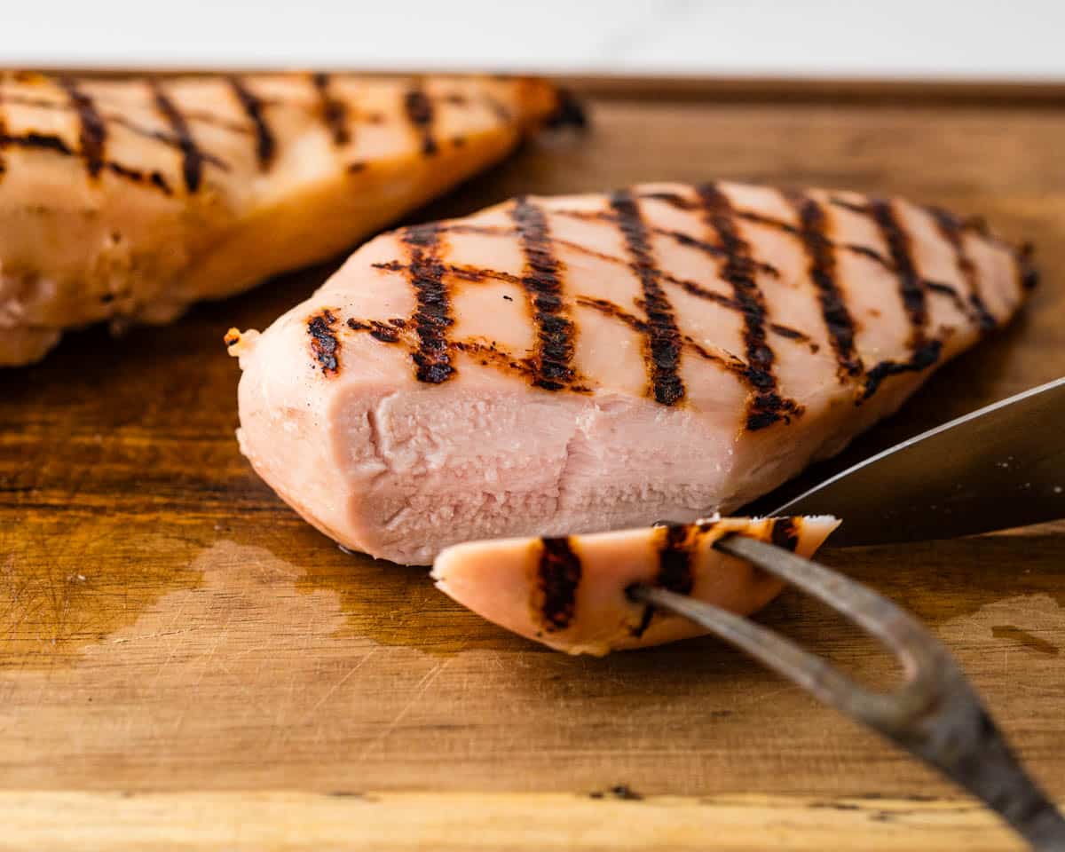 Slicing the brined chicken breast.
