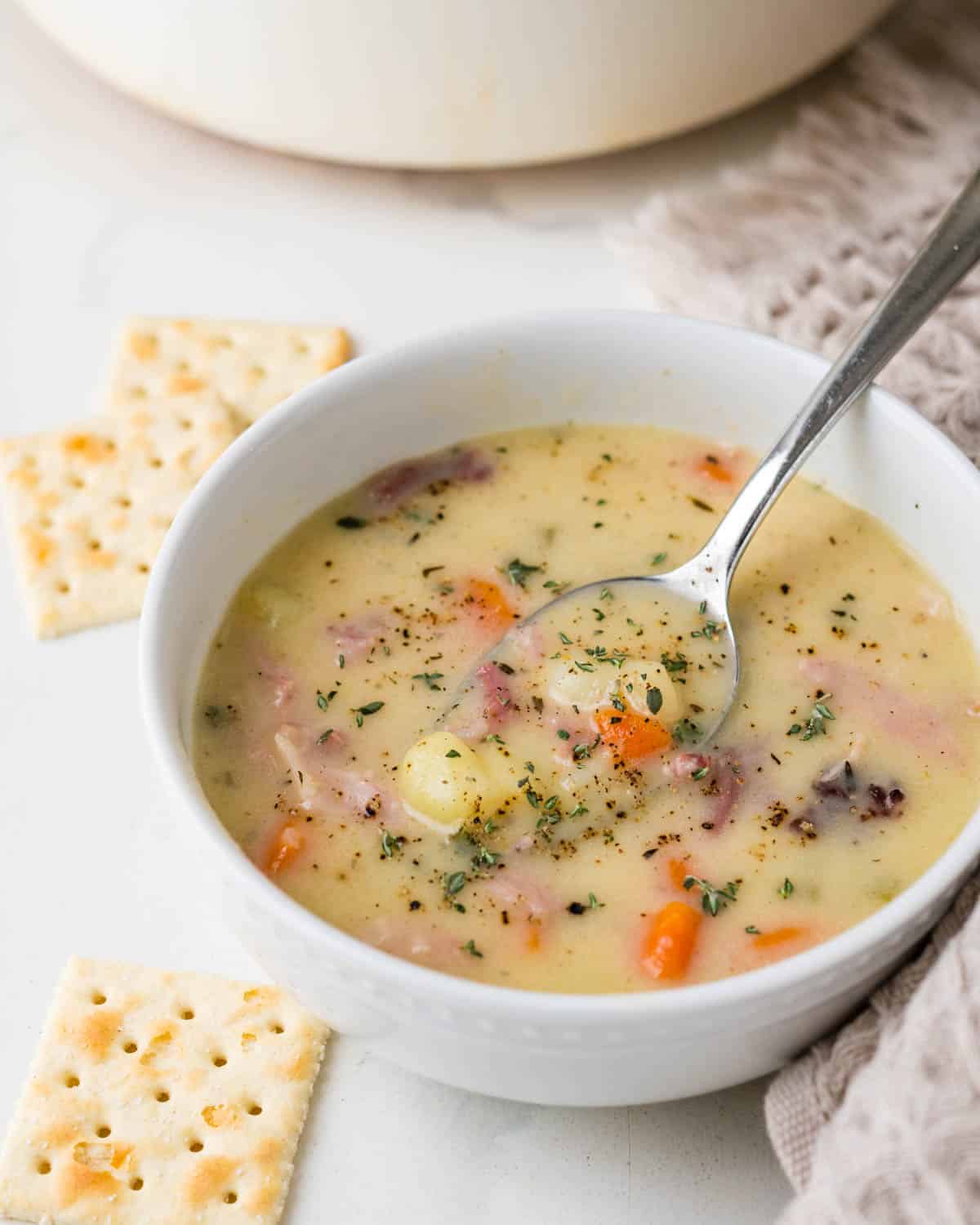 Serving crackers with a bowl of the soup.